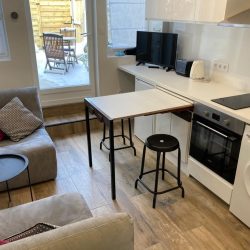 Kitchen and living area with view onto garden