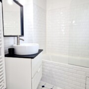 bathroom - bath with overhead shower, washbasin and storage unit at la terrasse fontainebleau